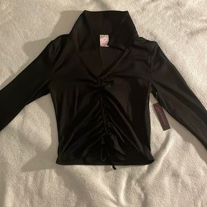 A black shirt with a collar ruched top.